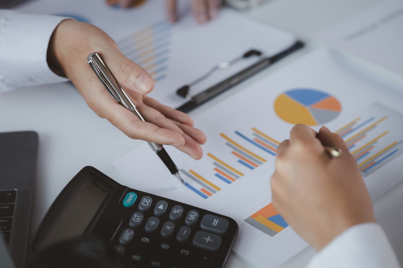 Two Businessmen Pointed To The Material For The Meeting, Working - Auster Inteligência Contábil