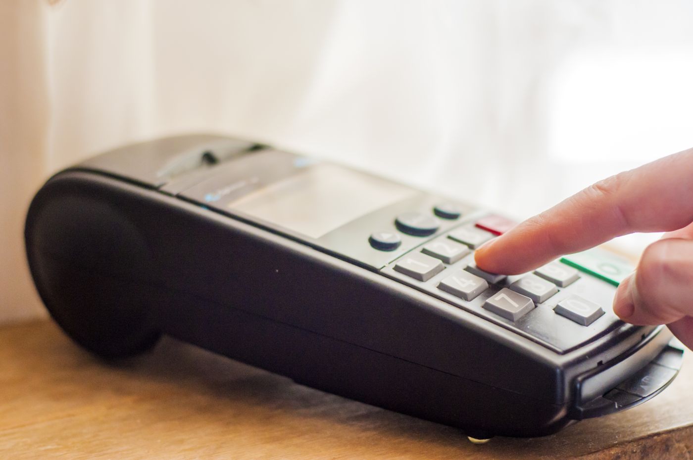 Payment With Credit Card Businessman Holding Pos Terminal. Pay - Auster Inteligência Contábil